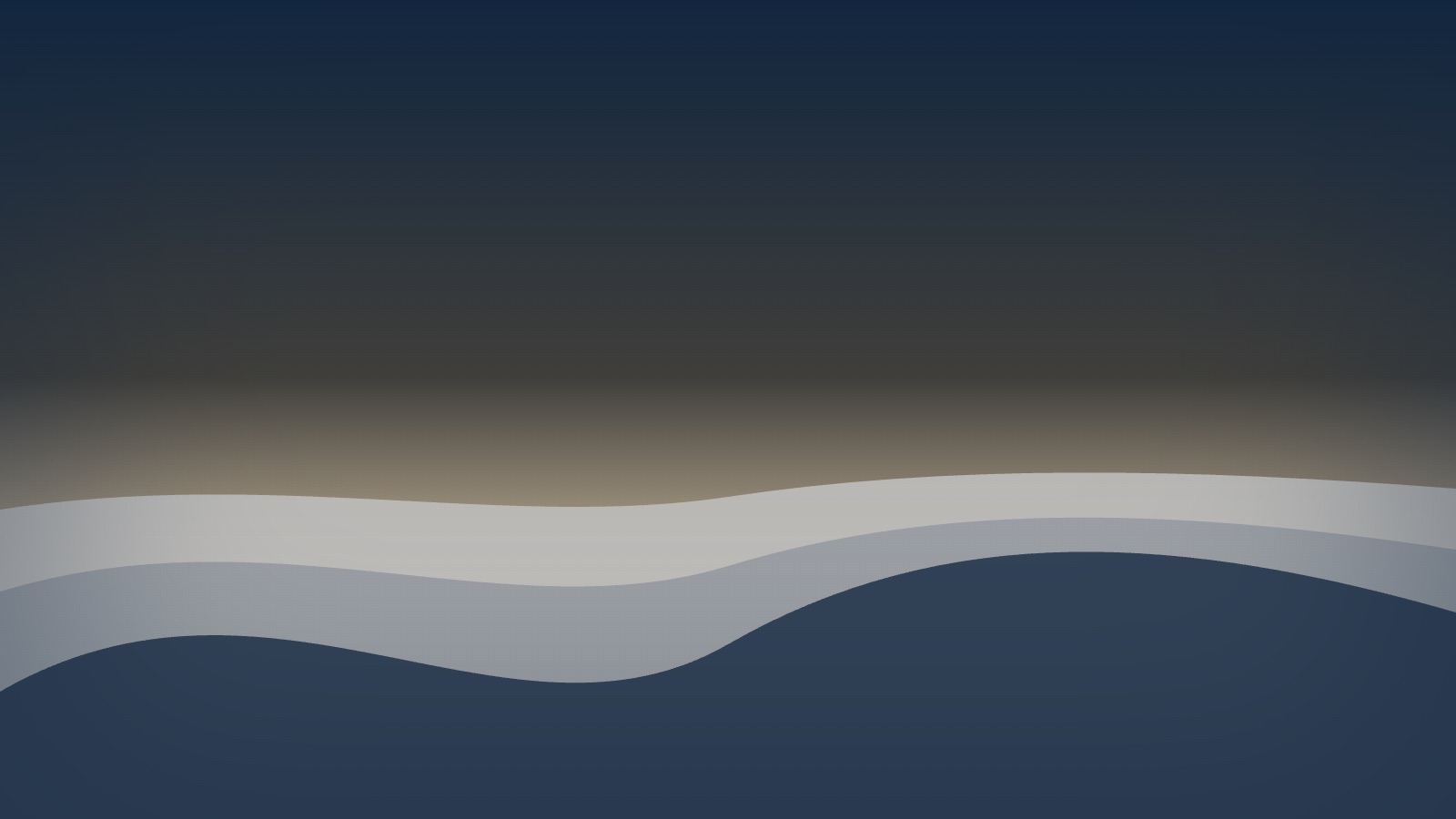Layered distant hills fading into gentle morning haze under a calm sky.